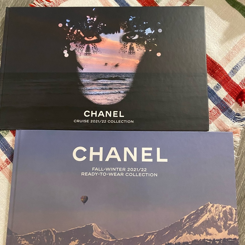 Two CHANEL books, one with postcards